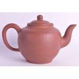 A 19TH CENTURY CHINESE YIXING POTTERY TEAPOT AND COVER of plain form with flared rim. 7ins wide.