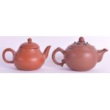 A SMALL EARLY 20TH CENTURY CHINESE YIXING POTTERY TEAPOT AND COVER together with another small