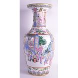 AN EARLY 20TH CENTURY CHINESE FAMILLE ROSE PORCELAIN VASE painted with figures standing within