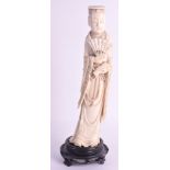 AN EARLY 20TH CENTURY CHINESE CARVED IVORY FIGURE OF AN IMMORTAL modelled holding a fan in one