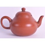 A 19TH CENTURY CHINESE YIXING POTTERY TEAPOT AND COVER of partial squat form. 6.5ins wide.