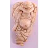 A 19TH CENTURY JAPANESE MEIJI PERIOD IVORY NETSUKE depicting a jovial buddhistic male holding