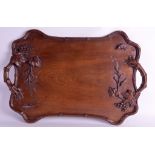 AN EARLY 20TH CENTURY CHINESE CARVED HARDWOOD TWIN HANDLED TRAY Late Qing, carved with squirrels and