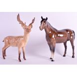 A BESWICK MODEL OF A STANDING BROWN HORSE together with another Beswick figure of a reindeer. 8.