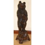 A LOVELY 19TH CENTURY BLACK FOREST CARVED BEAR the head rising top reveal a tin lined interior, with