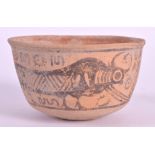 AN EARLY INDUS VALLEY TERRACOTTA CIRCULAR BOWL painted with buffalo like figures surrounded by