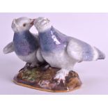 A 19TH CENTURY MEISSEN PORCELAIN FIGURAL GROUP OF LOVE BIRDS No.1134, modelled with beaks entwined