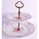 A BAVARIA SCHUMANN ARZBERG PORCELAIN CAKE STAND painted with flowers. 10ins high.