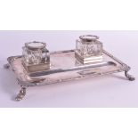 A SILVER ARTS AND CRAFTS STYLE ELIZABETH II GENTLEMANS DESK STAND Birmingham 1953, with scrolling