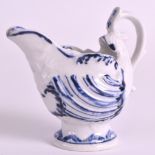 AN 18TH CENTURY DERBY SHELL MOULDED EWER painted with scrolls highlighting the moulding. 3.5ins