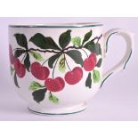 ATTRIBUTED TO WEMYSS (C1900) A LARGE SCOTTISH POTTERY BREAKFAST MUG painted with flowering vines.