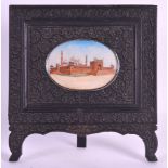 A LATE 19TH CENTURY INDIAN FRAMED IVORY MINIATURE depicting the Taj Mahal, contained within a floral