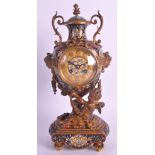 A LOVELY 19TH CENTURY FRENCH BRONZE AND CHAMPLEVÉ ENAMEL MANTEL CLOCK formed as a seated cherub