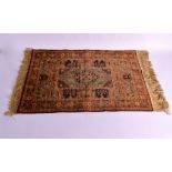 A LOVELY PERSIAN SILK PRAYER MAT decorated with floral panels and buildings. 2ft 6ins x 1ft 6ins.