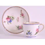 AN 18TH CENTURY SEVRES COFFEE CUP AND SAUCER painted by Pithou & Leandre with flowers under a blue