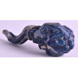 A CHINESE QING DYNASTY BLUE AND WHITE GLAZED STONEWARE PIPE modelled as an open buddhistic lion