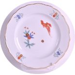 AN EARLY 20TH CENTURY MEISSEN SCALLOPED CABINET PLATE painted with a bird in flight in the