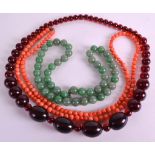 AN EARLY 20TH CENTURY CHINESE CARVED CORAL NECKLACE together with a thick green hardstone necklace &