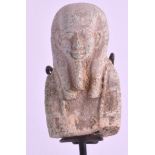 AN EGYPTIAN CARVED FAIENCE POTTERY HEAD OF A PHAROAH supported on an ebonised column. Head 2.75ins