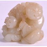 AN EARLY 20TH CENTURY CHINESE CARVED GREEN JADE FIGURE OF TWO CHILDREN modelled holding a floral