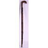 AN EARLY 20TH CENTURY NORTH AFRICAN SWORD STICK with thatch style banding and incised blade. 2ft