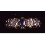 AN EDWARDIAN LADIES GOLD DIAMOND AND SAPPHIRE FIVE STONE RING.