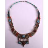 AN UNUSUAL EARLY 20TH CENTURY WHITE METAL TURQUOISE AND CORAL NECKLACE in the Egyptian Revival