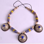 AN UNUSUAL EARLY 20TH CENTURY INDIAN NECKLACE formed from mosaic beads, lapis panels & gilded nuts.