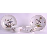 A GOOD PAIR OF MID 18TH CENTURY MEISSEN TEACUPS AND SAUCERS C1750 painted with scenes of birds