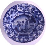 A 19TH CENTURY CHINESE BLUE AND WHITE PORCELAIN BOWL Kangxi style, painted with figures standing