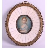 AN EARLY 20TH CENTURY EUROPEAN PAINTED IVORY MINIATURE depicting a young female within a bone