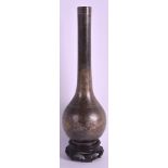 A CHINESE QING DYNASTY BRONZE BOTTLE NECK SLENDER FORM VASE finely inlaid with silver wire forming