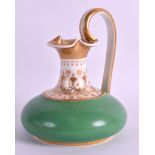 AN EARLY 19TH CENTURY BLOOR DERBY APPLE GREEN GLAZED JUG with high loop handles and gilt decoration.