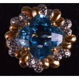 A 14K LADIES YELLOW GOLD DIAMOND AND BLUE TOPAZ RING.