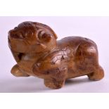 A GOOD 17TH/18TH CENTURY CHINESE CARVED MUTTON JADE FIGURE OF A BEAST Ming, modelled in a roaming