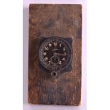 A WW2 LUFTWAFFE CHRONOGRAPH MILITARY AIRCRAFT CLOCK no. 10222, mounted upon a wooden plinth. Clock