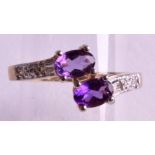 A 9CT GOLD AMETHYST AND DIAMOND RING.