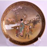 A LATE 19TH CENTURY JAPANESE MEIJI PERIOD SATSUMA DISH painted with figures within a landscape. 6ins
