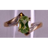 A 9CT GOLD AMBLYGONITE & DIAMOND RING.