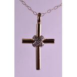 A 9CT YELLOW GOLD CROSS set with diamonds, together with a 9ct yellow gold chain.