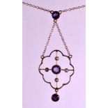 AN EDWARDIAN 9CT ROSE GOLD LAVALIERE NECKLACE set with amethyst and seed pearls.