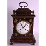 A REGENCY TORTOISESHELL AND BRASS MANTEL CLOCK with circular dial encased with floral roundels.