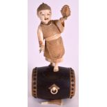 A LOVELY 19TH CENTURY JAPANESE IVORY AND BOXWOOD OKIMONO modelled as a young boy holding a fan