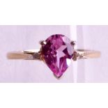 A 9CT GOLD PINK TOPAZ AND DIAMOND RING.