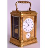 A FINE LATE 19TH CENTURY ENGRAVED BRASS CARRIAGE CLOCK by Howell Jones & Co, decorated all over with