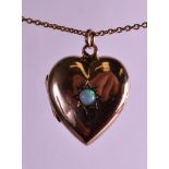 A VICTORIAN 9CT YELLOW GOLD HEART SHAPED LOCKET SET with natural opal and 9ct gold chain.