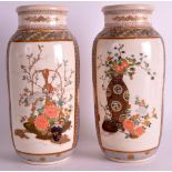 A PAIR OF LATE 19TH CENTURY JAPANESE MEIJI PERIOD SATSUMA VASES decorated with urns of flowers,