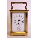 AN EARLY 20TH CENTURY FRENCH BRASS CARRIAGE ALARM CLOCK. 5.75ins high.