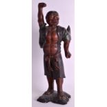 A 19TH CENTURY JAPANESE MEIJI PERIOD LACQUERED FIGURE OF A WARRIOR modelled with one hand raised