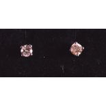 A PAIR OF 9CT WHITE GOLD AND DIAMOND SET EARRINGS.